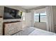 Serene bedroom with a water view, a dresser, and cozy decor, perfect for relaxation at 16300 County Road 455 # 511, Montverde, FL 34756