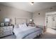 Cozy bedroom featuring a vintage-style bed frame, matching dressers, and ample natural light at 16300 County Road 455 # 511, Montverde, FL 34756