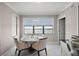 Charming dining area with a round table, seating for four, and stunning water views at 16300 County Road 455 # 511, Montverde, FL 34756