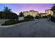 Beautiful condo complex with lush landscaping at twilight at 16300 County Road 455 # 511, Montverde, FL 34756