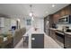 Modern kitchen with stainless steel appliances and a large island at 16300 County Road 455 # 511, Montverde, FL 34756