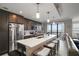 Large kitchen island with stainless steel appliances and ample seating at 16300 County Road 455 # 511, Montverde, FL 34756