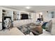 Comfortable living room boasts custom built-ins, dedicated workspace, and stylish furnishings at 16300 County Road 455 # 511, Montverde, FL 34756