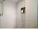 Contemporary tiled shower with a built-in niche and modern fixtures at 16300 County Road 455 # 511, Montverde, FL 34756