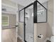 Modern bathroom featuring a glass shower, marble tile, and modern fixtures at 16380 Se 83Rd Ct, Summerfield, FL 34491