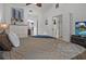 Bright bedroom featuring a comfortable bed, white walls and trim, and lots of natural light at 1705 S Atlantic Ave # 502, New Smyrna Beach, FL 32169