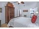 Bedroom featuring a four-poster bed and ensuite closet and bathroom at 1705 S Atlantic Ave # 502, New Smyrna Beach, FL 32169