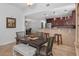 Open concept dining area featuring views of the modern kitchen with breakfast bar at 1705 S Atlantic Ave # 502, New Smyrna Beach, FL 32169