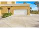 Attached garage with white door and plenty of parking space at 1705 S Atlantic Ave # 502, New Smyrna Beach, FL 32169