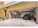 Spacious open garage featuring a car parked inside, white walls and plenty of storage space at 1705 S Atlantic Ave # 502, New Smyrna Beach, FL 32169