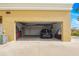 Spacious open garage featuring a car parked inside, white walls and plenty of storage space at 1705 S Atlantic Ave # 502, New Smyrna Beach, FL 32169