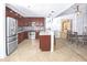 Bright kitchen with stainless steel appliances, granite countertops, and breakfast bar at 1705 S Atlantic Ave # 502, New Smyrna Beach, FL 32169