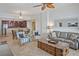 Inviting living room featuring tile floors, comfortable seating, and seamless access to a modern kitchen at 1705 S Atlantic Ave # 502, New Smyrna Beach, FL 32169