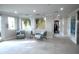 Comfortable lobby featuring seating with palm tree views from the large windows and neutral decor at 1705 S Atlantic Ave # 502, New Smyrna Beach, FL 32169
