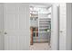 Spacious pantry with multiple shelves, providing ample storage space for food and household items at 1705 S Atlantic Ave # 502, New Smyrna Beach, FL 32169