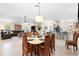 Dining and living areas, featuring tiled flooring and contemporary furnishings at 1716 Bugle Ter, The Villages, FL 32162