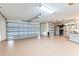 Spacious three car garage with ample storage space and automatic door openers at 1716 Bugle Ter, The Villages, FL 32162