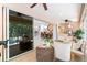 Lanai with kitchen, living and dining spaces with an easy flow for entertaining and relaxing at 1716 Bugle Ter, The Villages, FL 32162