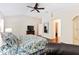 Spacious main bedroom with hardwood floors and a view to closet and entry way at 1716 Bugle Ter, The Villages, FL 32162