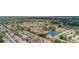 Community aerial view featuring homes, manicured lawns, mature trees, and golf course at 17806 Se 97Th Ct, Summerfield, FL 34491