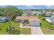 Inviting single-story home with a manicured lawn and a convenient attached two-car garage at 17806 Se 97Th Ct, Summerfield, FL 34491