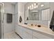 Bathroom featuring a single sink vanity, an enclosed shower, and tile flooring at 17806 Se 97Th Ct, Summerfield, FL 34491