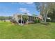Charming single-story home with screened in patio and lush landscaping at 17806 Se 97Th Ct, Summerfield, FL 34491