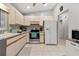 Bright eat-in kitchen features tile flooring, plenty of cabinets and stainless steel appliances at 17806 Se 97Th Ct, Summerfield, FL 34491
