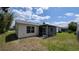 Backyard featuring a screened lanai at 17930 Se 83Rd Melody Ave, The Villages, FL 32162