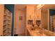 Bathroom with blue walls, marble counter, decorative shower curtain, and ample natural light at 17930 Se 83Rd Melody Ave, The Villages, FL 32162