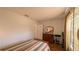 A bedroom with hardwood flooring, a window and a dresser at 17930 Se 83Rd Melody Ave, The Villages, FL 32162