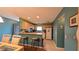 Eat-in kitchen with breakfast bar, tile floor and stainless steel trash receptacle at 17930 Se 83Rd Melody Ave, The Villages, FL 32162