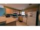 A well-lit kitchen with lighter colored cabinets and updated appliances at 17930 Se 83Rd Melody Ave, The Villages, FL 32162
