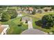 Aerial view of a beautiful home in a well-maintained community with lush landscaping at 17985 Se 102Nd Ct, Summerfield, FL 34491