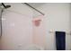 Bathroom area features a pink tiled shower and updated fixtures, creating a clean and functional space at 17985 Se 102Nd Ct, Summerfield, FL 34491