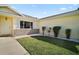 Well-manicured front yard with lush green grass, decorative rocks, and neatly trimmed shrubs at 17985 Se 102Nd Ct, Summerfield, FL 34491