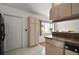 Functional kitchen area featuring ample storage cabinets, countertops, and a connection to the dining area at 17985 Se 102Nd Ct, Summerfield, FL 34491