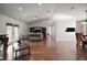 Spacious living room with hardwood floors, vaulted ceilings, and ample natural light at 17985 Se 102Nd Ct, Summerfield, FL 34491