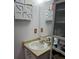 Compact bathroom features a sink and mirrored vanity for storage at 1805 Ne 29Th Pl, Ocala, FL 34479