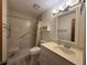 Bright bathroom with tiled shower, vanity, and modern fixtures at 1805 Ne 29Th Pl, Ocala, FL 34479