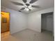 The bedroom has a ceiling fan and entrance to the walk-in closet at 1805 Ne 29Th Pl, Ocala, FL 34479