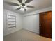 Bedroom features include a ceiling fan and built-in shelving at 1805 Ne 29Th Pl, Ocala, FL 34479