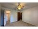 Cozy bedroom with carpet, ceiling fan, and closet at 1805 Ne 29Th Pl, Ocala, FL 34479