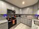 Modern kitchen with granite countertops and stainless steel appliances at 1805 Ne 29Th Pl, Ocala, FL 34479