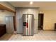 Spacious kitchen with stainless steel refrigerator and ample cabinet space at 1805 Ne 29Th Pl, Ocala, FL 34479