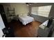 Bedroom featuring hardwood floors, natural light, and modern interior at 18130 Keene Rd, Altoona, FL 32702