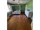 Spacious bedroom with hardwood floors, natural light, and a large canopy bed at 18130 Keene Rd, Altoona, FL 32702