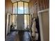 Inviting foyer with large windows, stone flooring, and ample natural light at 18130 Keene Rd, Altoona, FL 32702