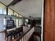 Open-concept living and dining area featuring wood floors, high ceilings, and large windows at 18130 Keene Rd, Altoona, FL 32702