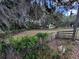 Spacious property with lush greenery, fencing, mature trees, and a peaceful, secluded atmosphere at 18130 Keene Rd, Altoona, FL 32702